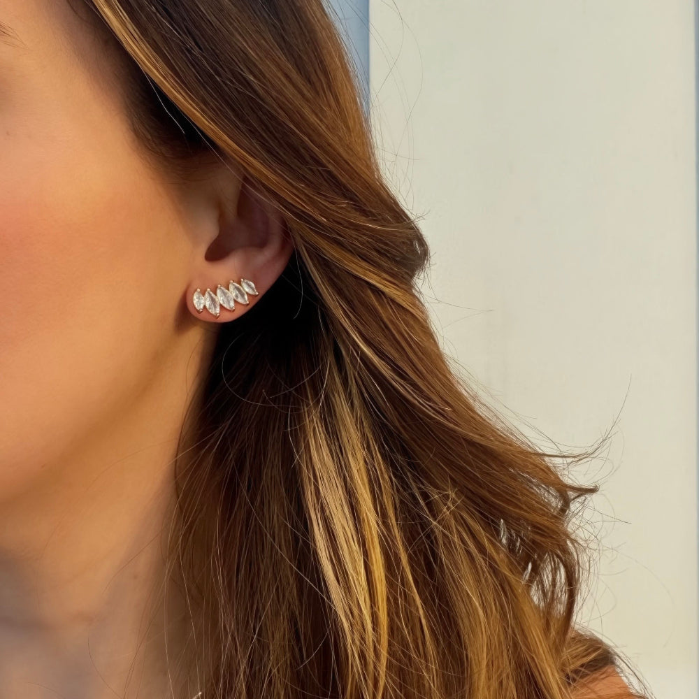 Woman wearing marquise cubic zirconia ear climber earrings