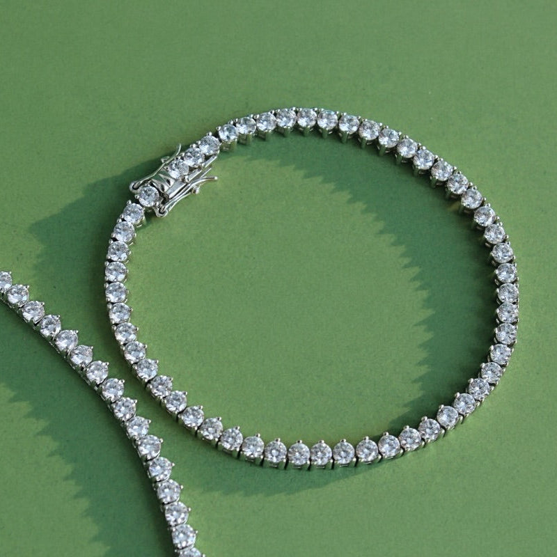 Diamond tennis bracelet on a green background