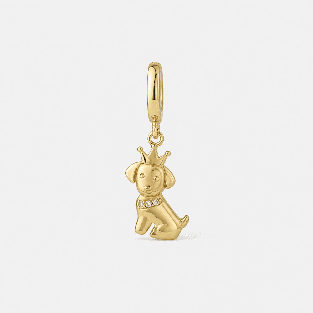 Gold plated dog charm close-up