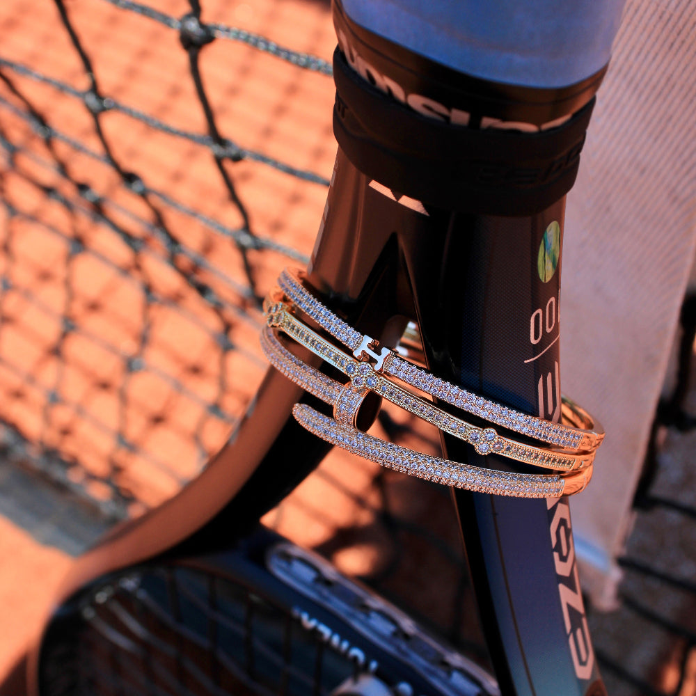 Close-up of a tennis racket with a blurred background
