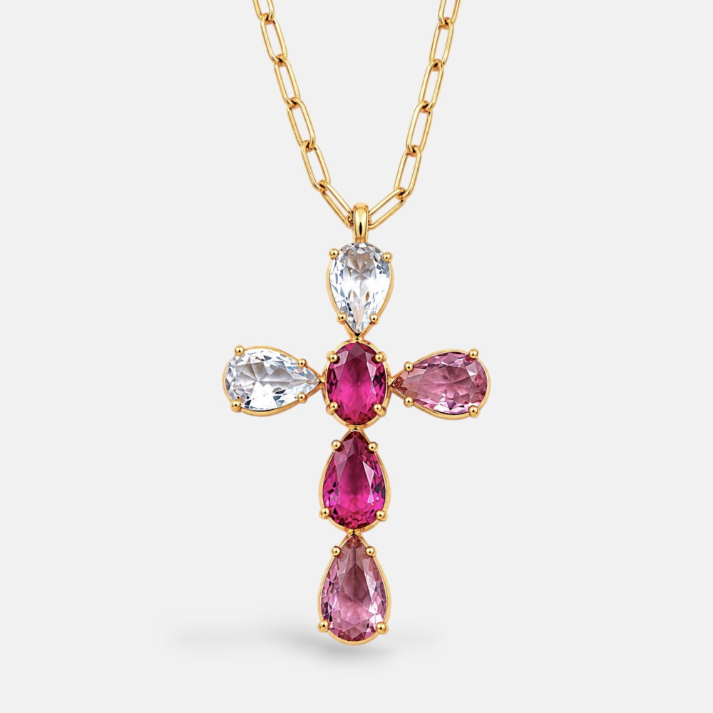 Gold necklace with pink gemstone pendant on a white background