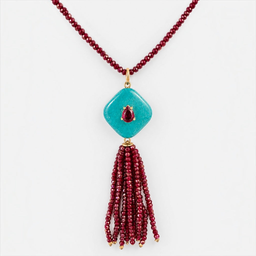 Front view of coral-red jade necklace with reconstituted turquoise pendant, red gemstone-coloured accent and tassel