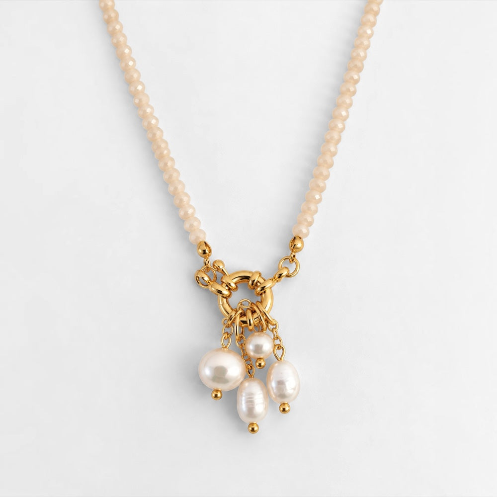 Cream-coloured jade bead necklace with freshwater pearl charms and gold-plated circular clasp