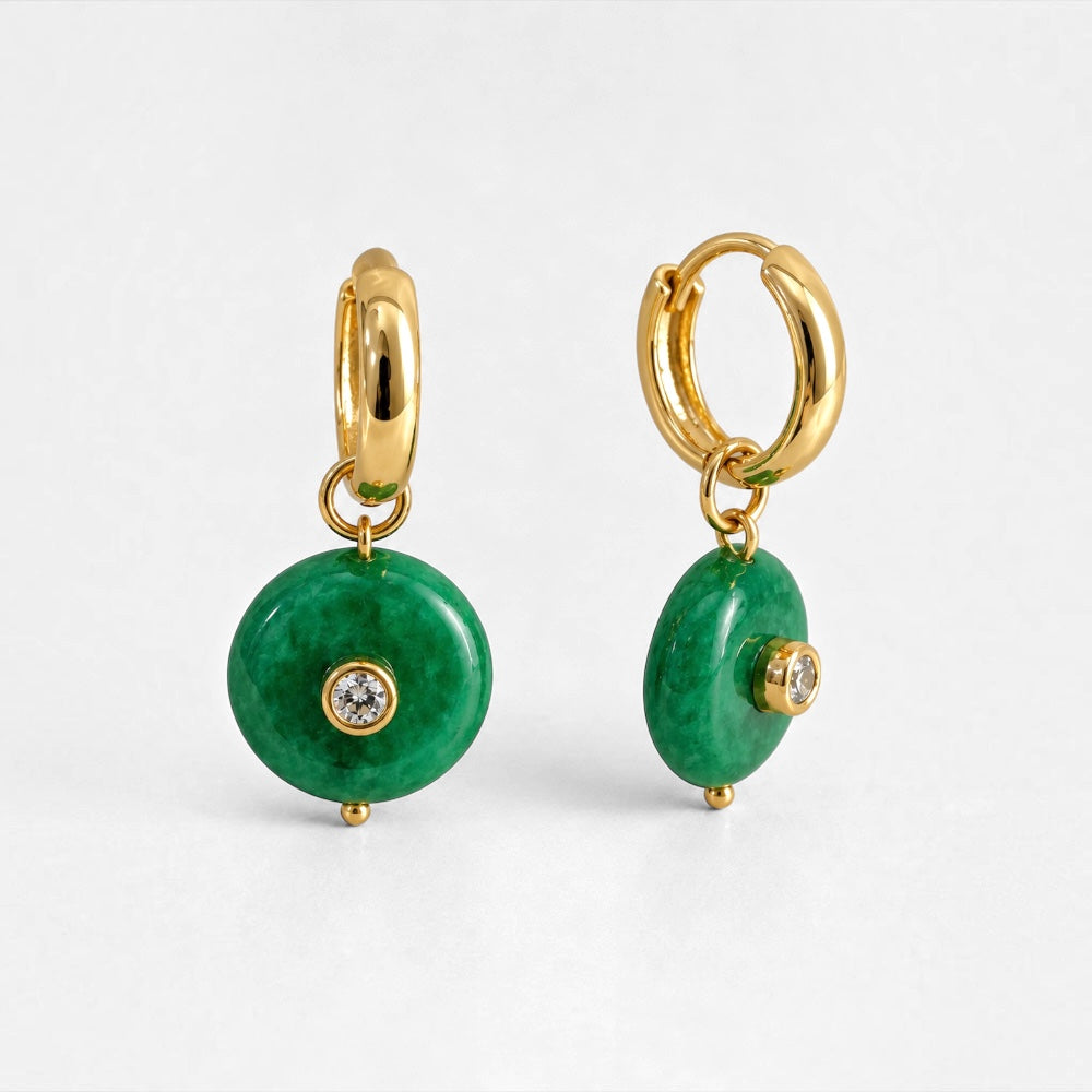 Close-up and side view of gold-plated hoop earrings with round green jade disc pendants