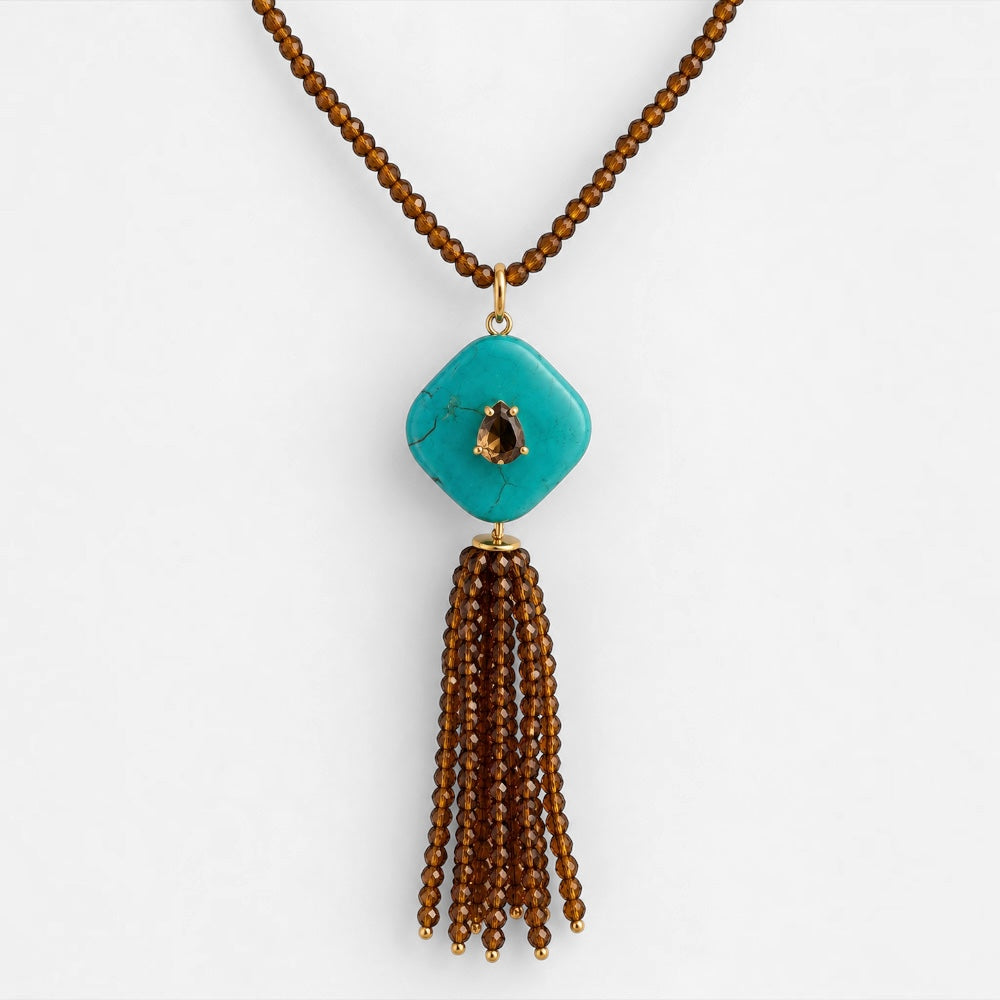 Brown jade beaded tassel necklace with reconstituted turquoise pendant and gold-plated details