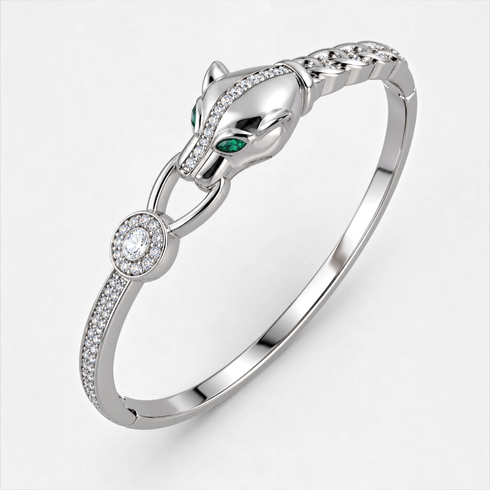 Silver-plated brass bangle with sculptural panther head, green eyes and clear cubic zirconia pavé detailing