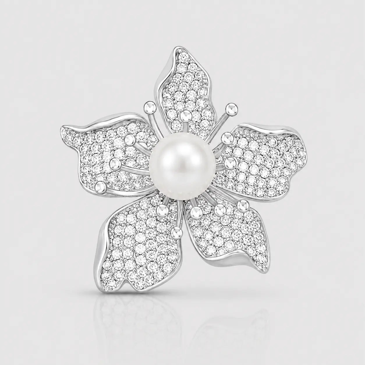 Silver plated pearl flower brooch with cubic zirconia petals