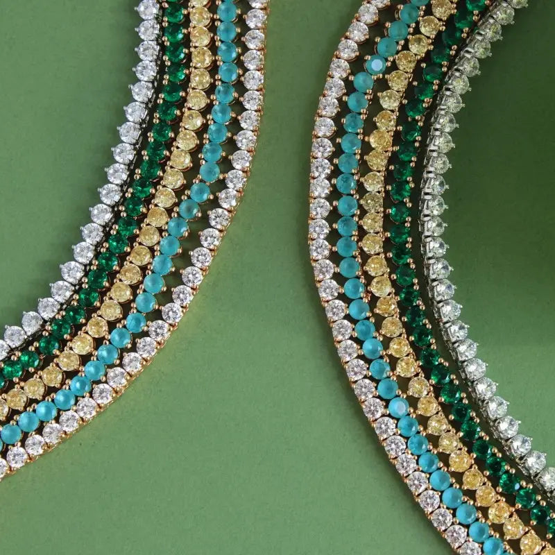 Close-up of a decorative border with multicolored beads on a green background