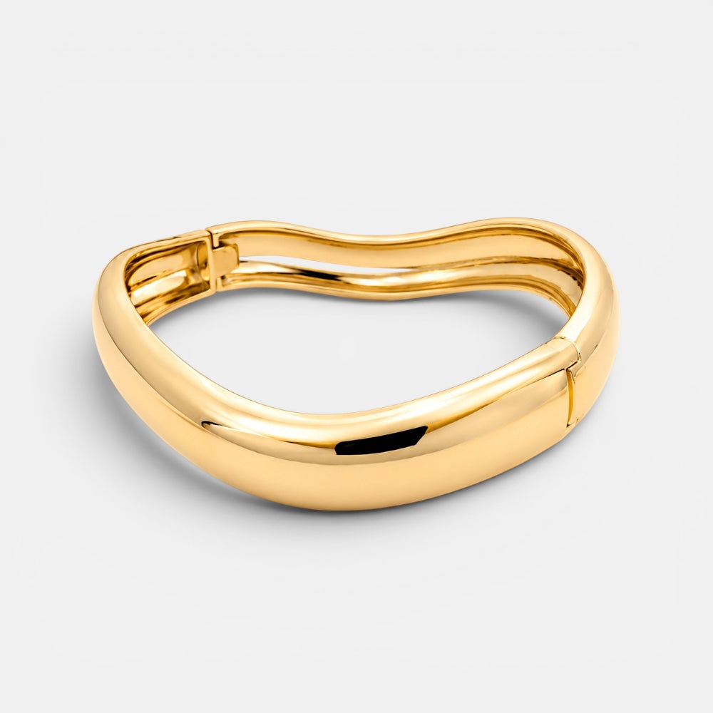 Gold plated twisted bangle bracelet detail