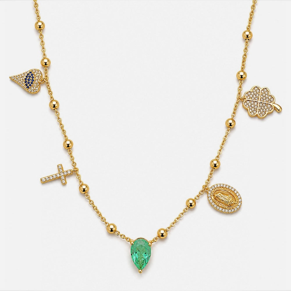 Gold plated symbolic charm necklace with blue heart cross green stone Virgin Mary and clover charms