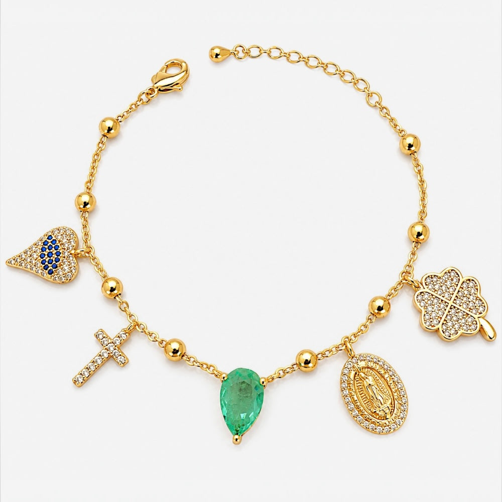Gold plated charm bracelet with religious cross heart and symbolic charms
