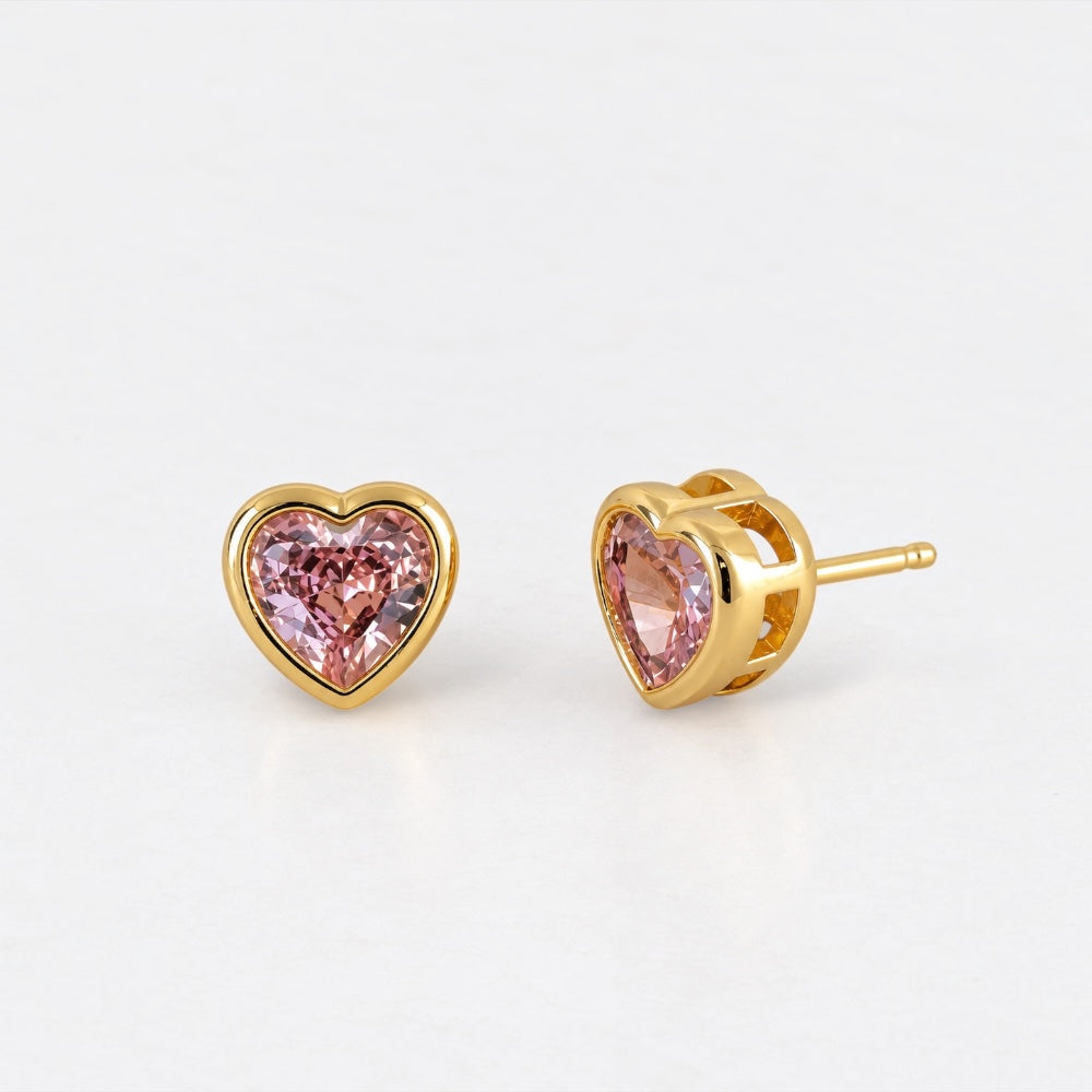 Gold plated heart stud earrings featuring pink cubic zirconia stones by Villa Valentina Jewellery.