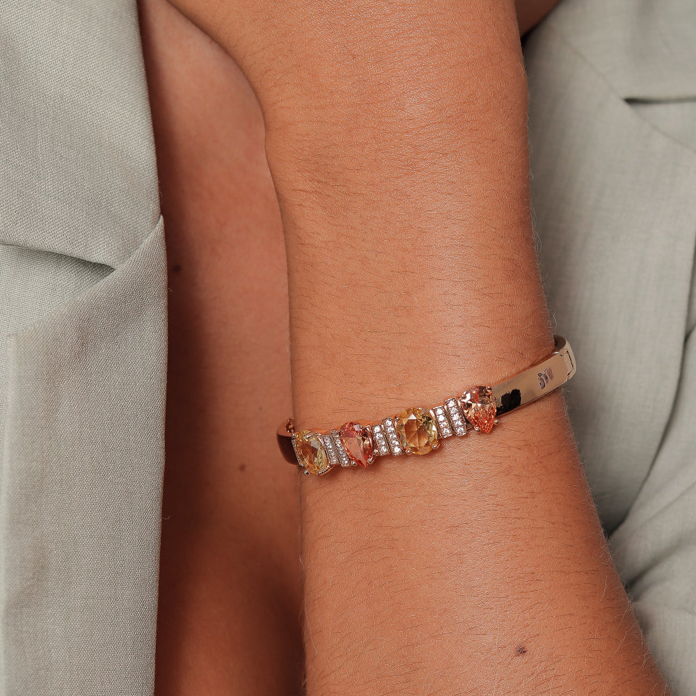 Close-up of a wrist wearing a bracelet with multicolored stones