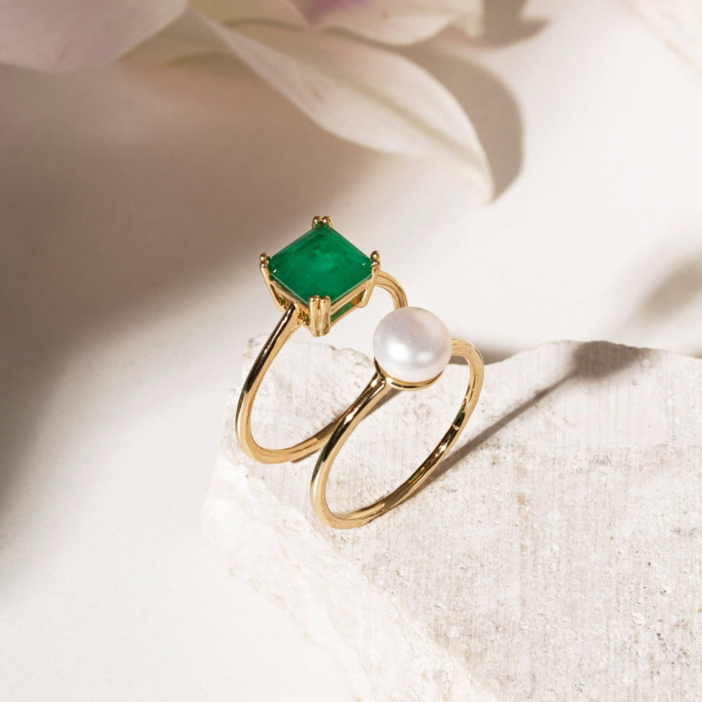 Pair of gold-plated brass rings with square emerald-coloured Fusion stone and round freshwater pearl