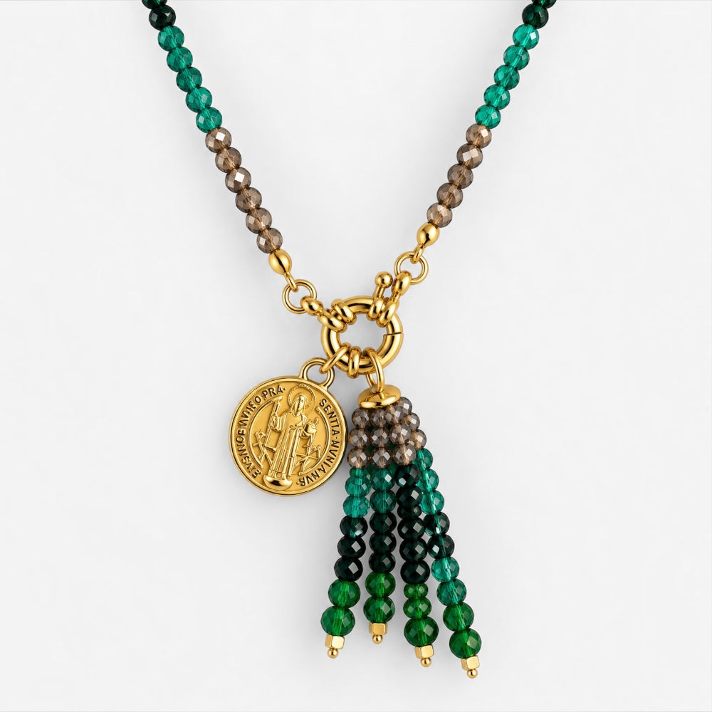 Close-up of green jade bead tassel necklace with gold-plated Saint Benedict medallion and beaded tassel