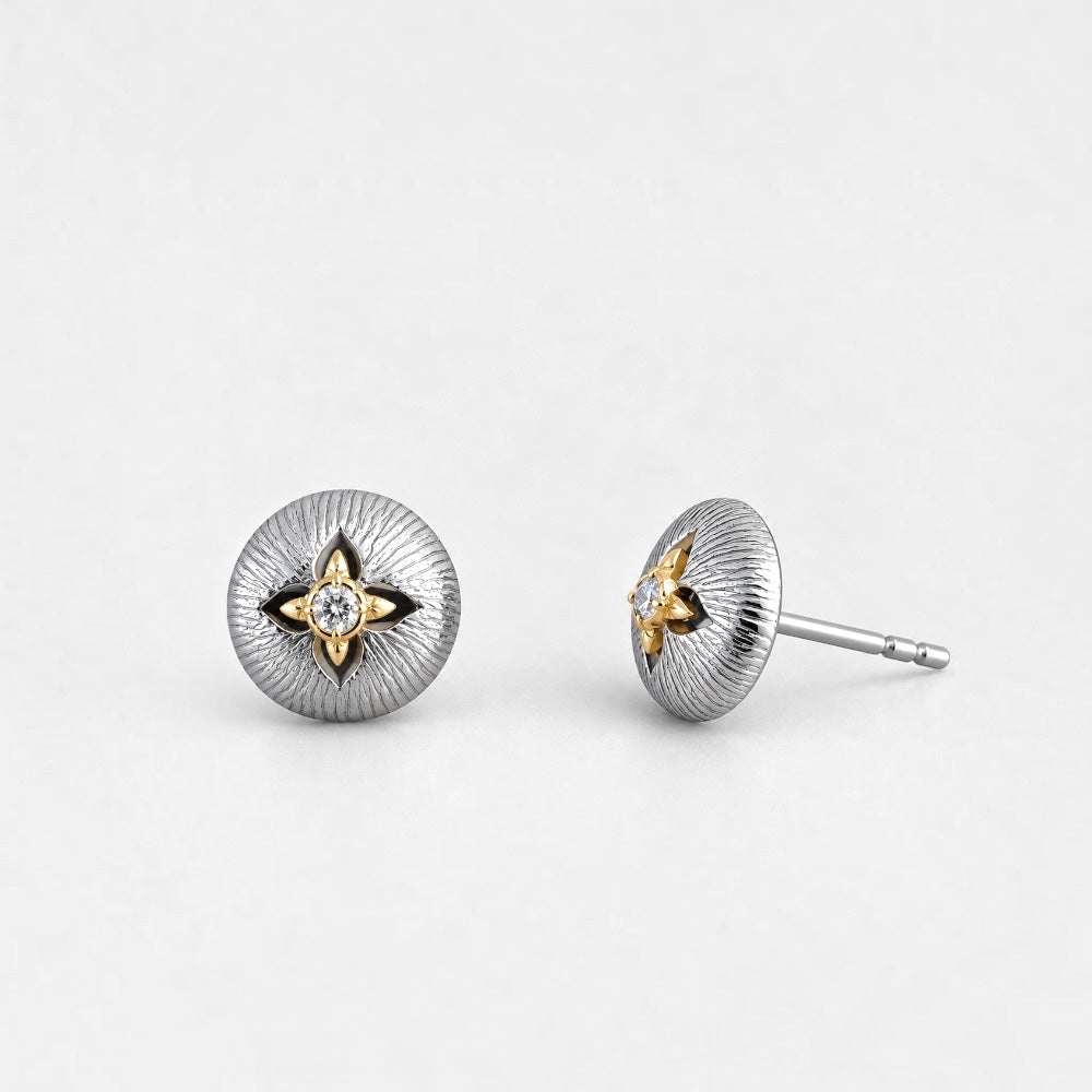Round textured sterling silver stud earrings with gold-tone four-point star details and clear centre accents