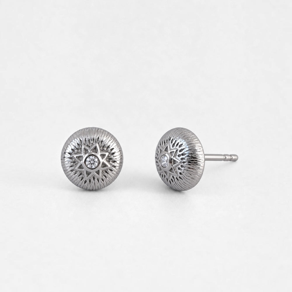 Round sterling silver stud earrings with textured sunburst design and clear centre accents
