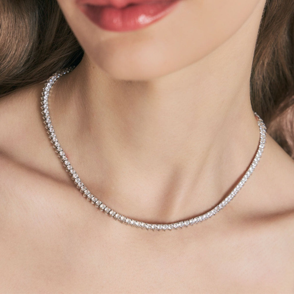 Close-up of a diamond necklace on a model's neck